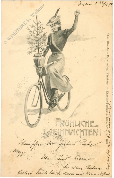 weihnachten: dame auf fahrrad mit baum