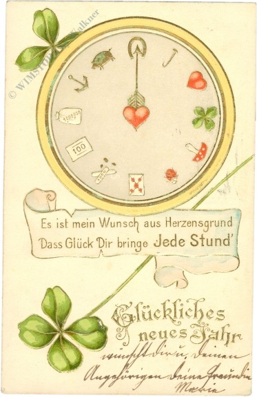 neujahr uhr mit glücksbringer