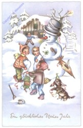 Kinder bauen einen Schneemann