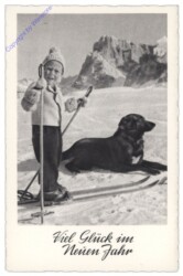 Kind auf Schi mit Hund