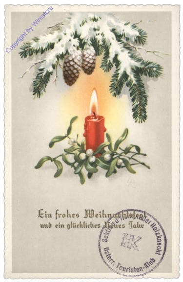 Kerze mit Mistelzweig und Tannenzweigen