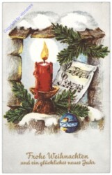 Kerze mit Notenblatt und Zweigen