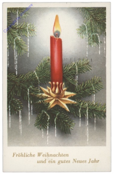 Kerze auf Tannenzweig