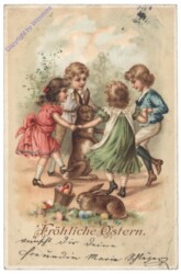 Kinder tanzen um den Osterhasen
