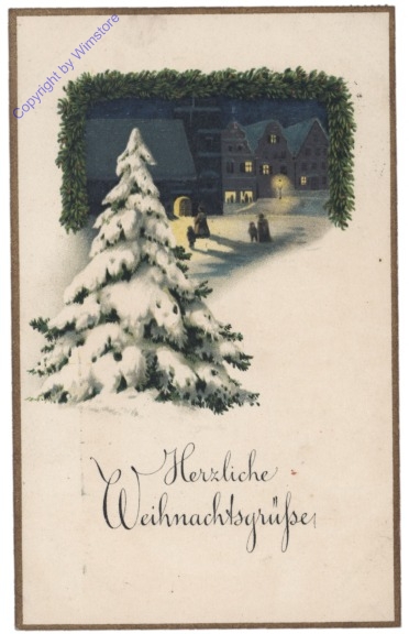 Verschneiter Baum im Dorf