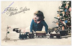 ak190529 Mädchen spielt vor dem Christbaum