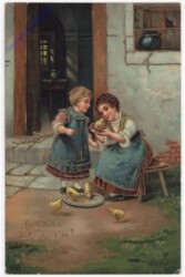 Kinder füttern die Hühner
